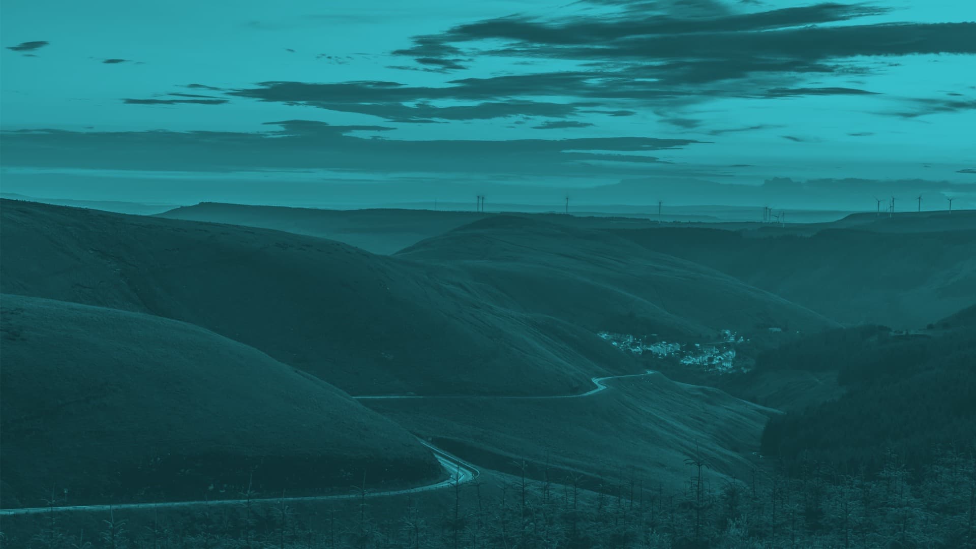 Cyclists cruising along the riverside section of the Taff Trail.